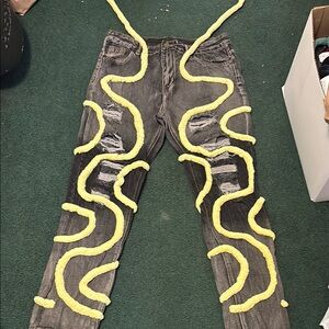 Stylish Distressed Gray Jeans with Yellow Accents